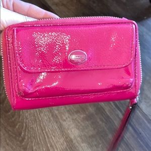 Shiny pink coach wristlet
